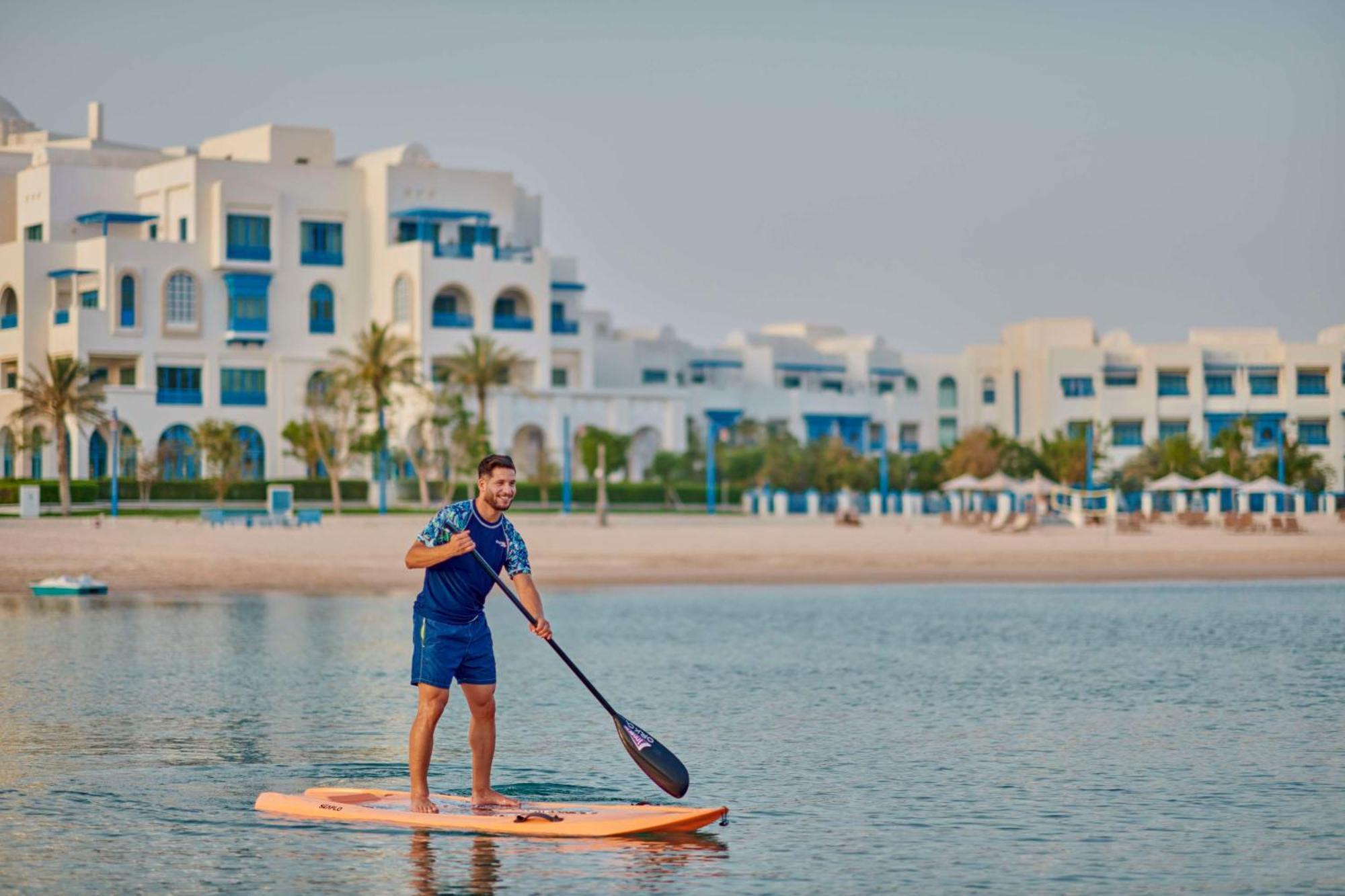 Hilton Salwa Beach Resort And Villas Abu Samra Zewnętrze zdjęcie Stand Up Paddle Boarding at Al Habtoor Polo & Equestrian Club